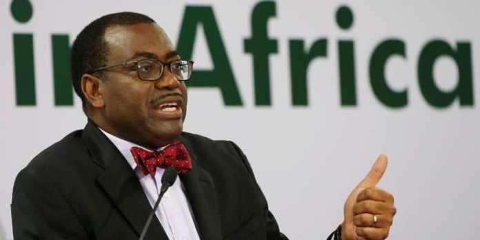 AfDB President Adesina gestures as he addresses a news conference on the first day of the annual meeting of AfDB in Gandhinagar
